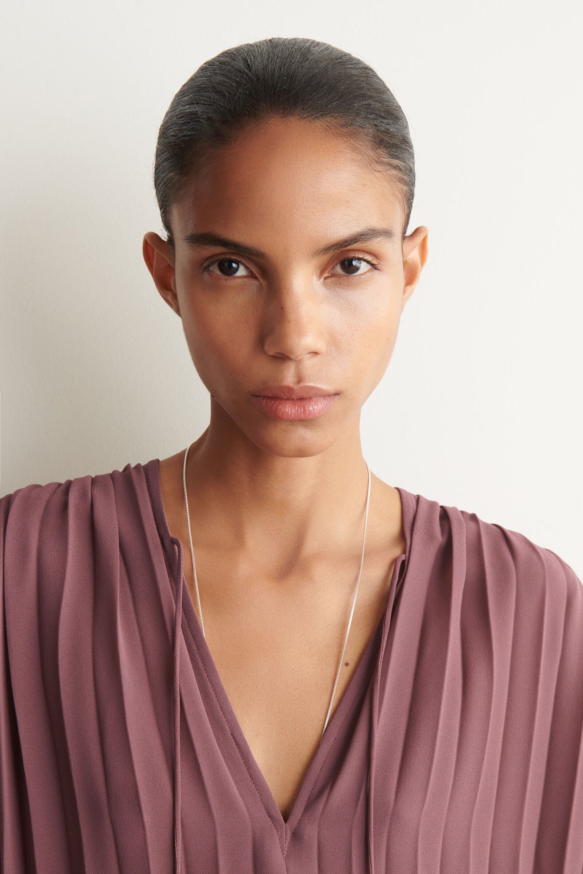 BLUSA DE GEORGETTE PLISADA CON LAZO - ÓXIDO