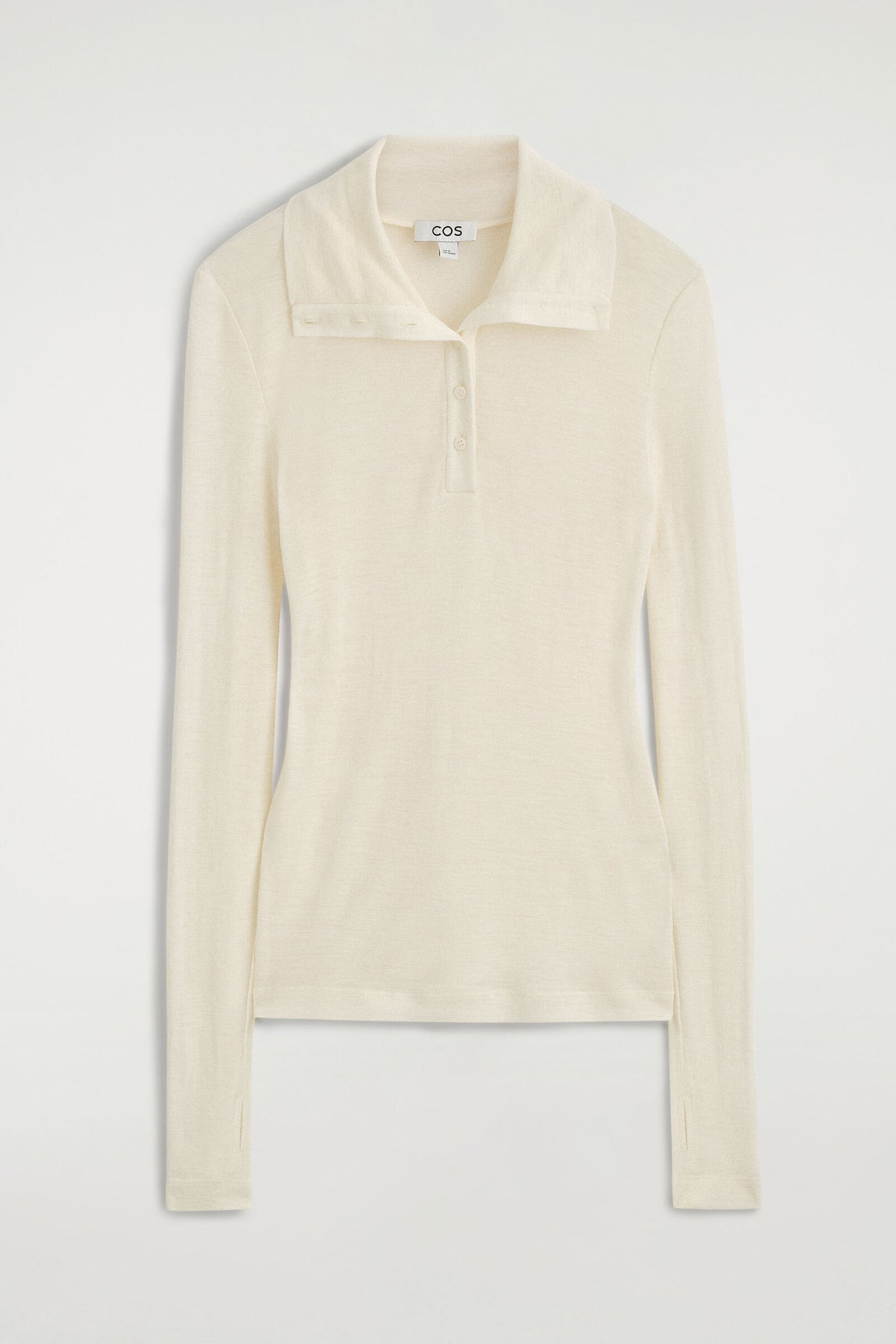 TOP DE MERINO CON CUELLO DE TROMPETA Y BOTONES - MARFIL | DescriptiveStillLife