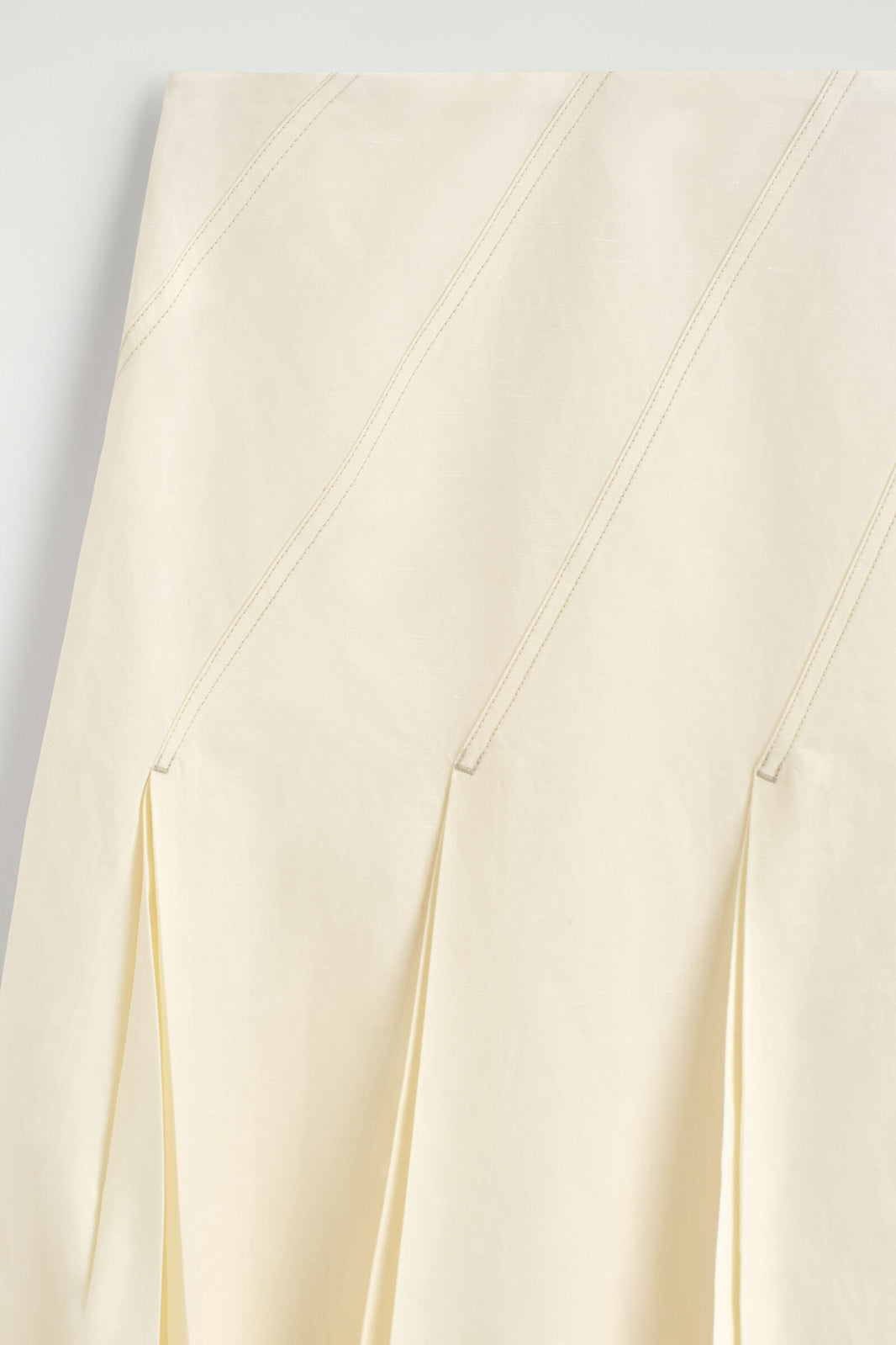 FALDA MIDI DE ALGODÓN Y LINO PLISADA - MARFIL | DescriptiveDetail