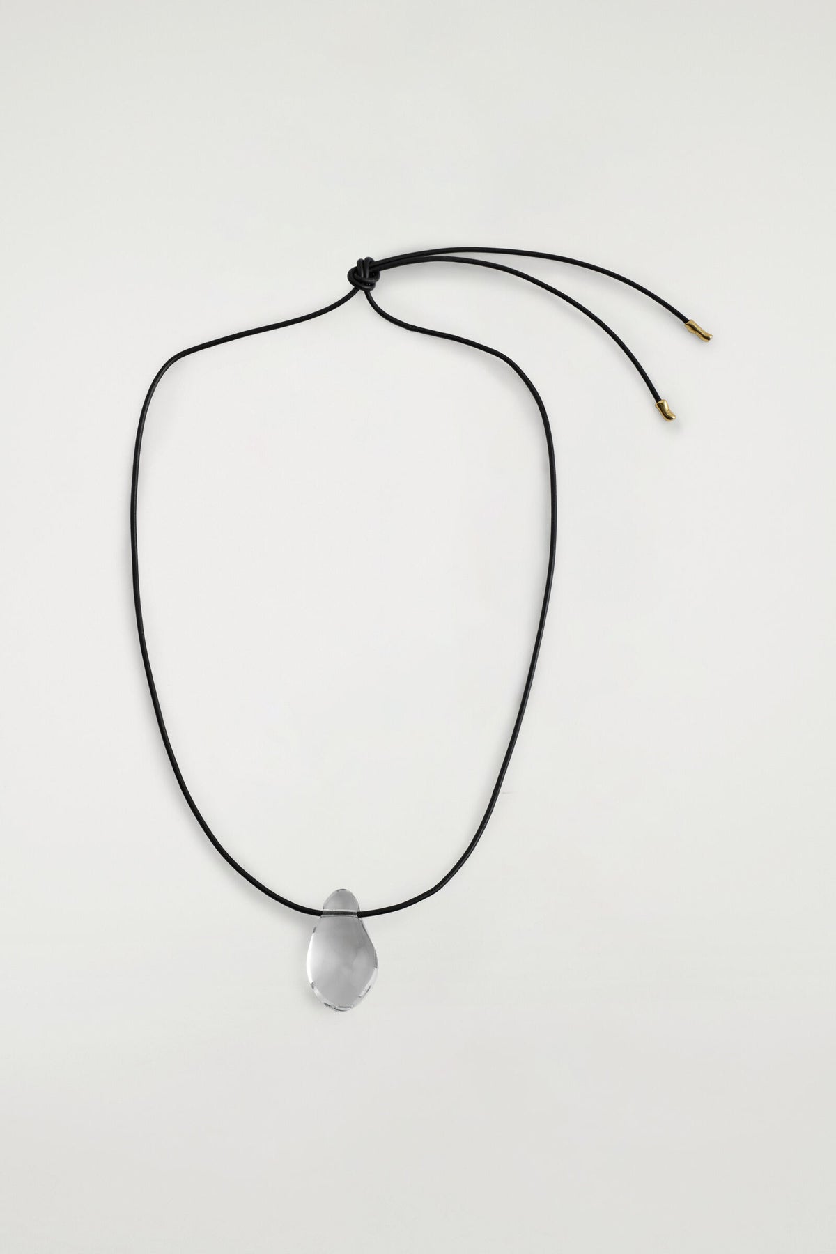COLLAR CON DISEÑO DE CÁMARA DE VIDRIO - TRANSPARENTE / NEGRO | DescriptiveStillLife