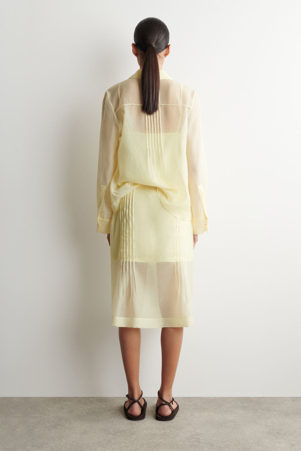 FALDA TRANSPARENTE CON PLISADO - AMARILLO